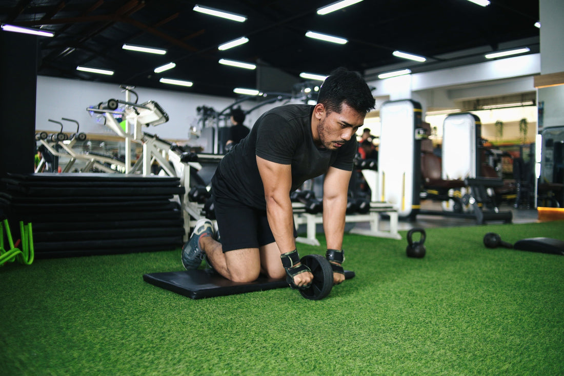 a man working out on turf inside of a gym