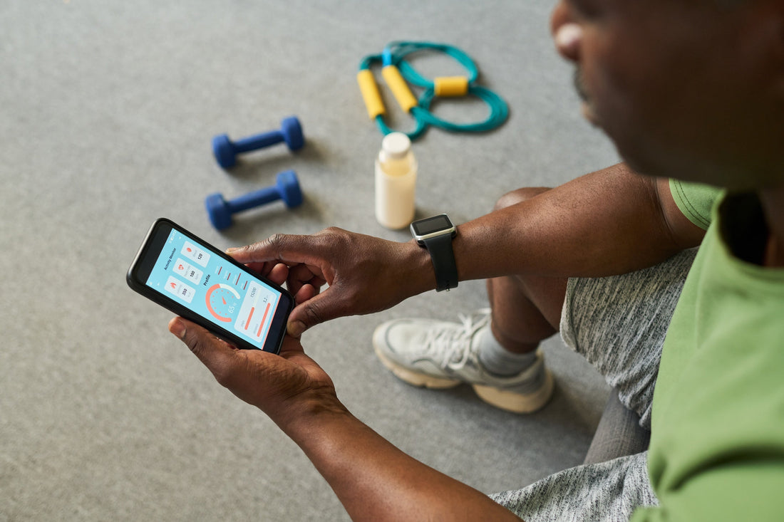 a man looking at a fitness tracking app
